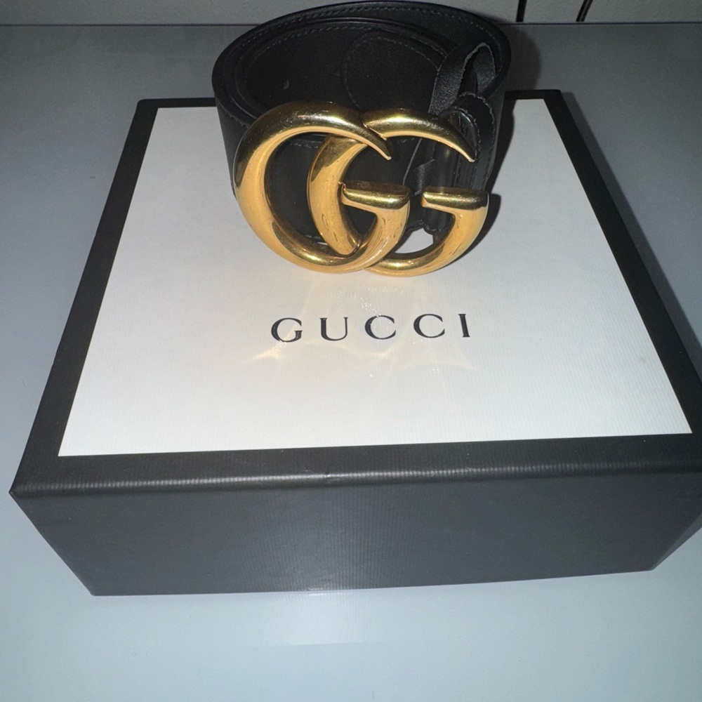 Gucci Black and Gold Statement Belt with Iconic GG Buckle